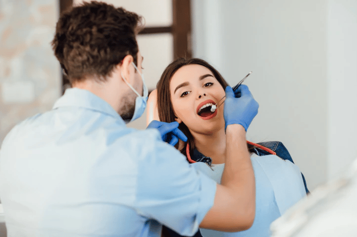 A woman treating herself in a dental clinic