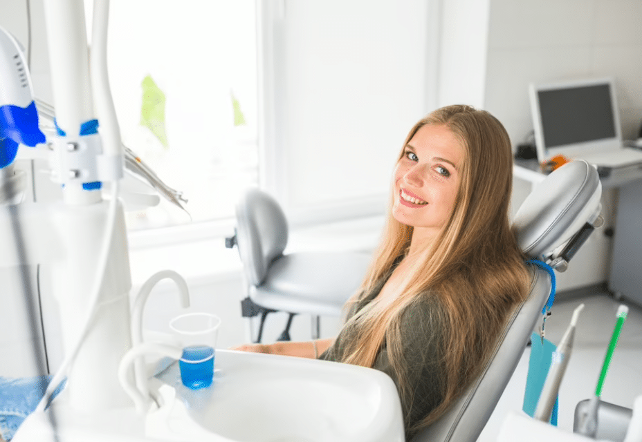 A woman sitting on a dental chair